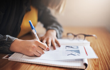 Her study methods are take notes. Cropped shot of an unrecognizable female university student in...