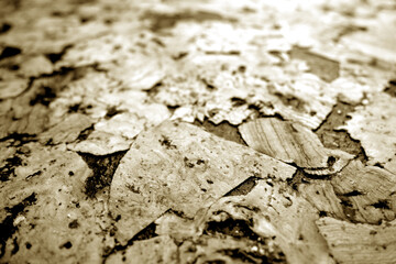 Cork board texture with blur effect in brown tone.