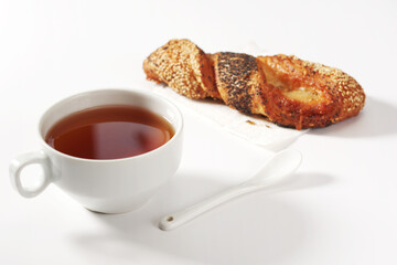 Tea and bun with seeds