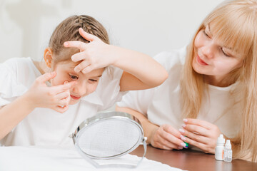 ophthalmologist explains to girl how to use night treatment contact lenses 