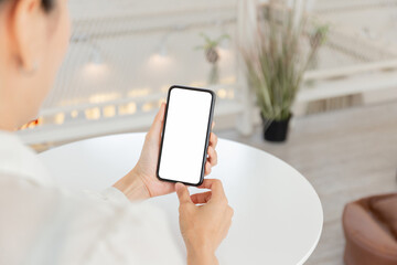 cell phone blank white screen mockup.hand holding texting using mobile on desk at office.background empty space for advertise.work people contact marketing business,technology