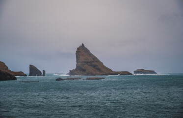 The view of the Drangarnir from the scenic road between Bour and Gasadalur. Dramatic landscape, november 2021
