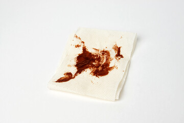 Dirty toilet paper sheet on white background with copy space