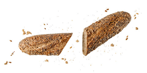 Fresh baked sliced multi grain baguette with poppy, sunflower, sesame seeds flying isolated on white background.
