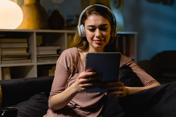 woman using digital tablet at home. night scene