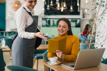 woman ordering food in restaurant