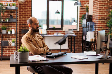 Financial agency office person developing campaign marketing strategy while in office workspace....