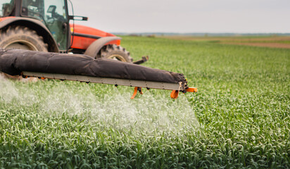 Farmer with tractor seeding