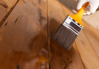 Close up of paint coating and protection of wooden surfaces