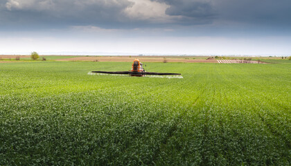 Farmer with tractor seeding