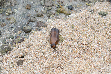 garbage on the beach, dirty sea