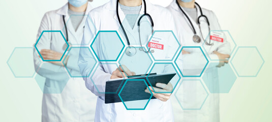 Three doctors stand in a group standing side by side, holding a tablet for notes and a stethoscope....