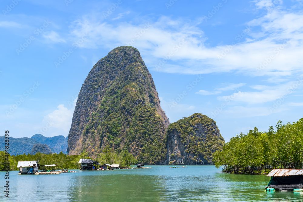 Wall mural banhinrom village, pier for boat to khao tapu or james bond island, famous tourist destination in ao