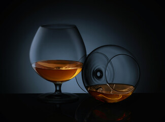 Elegant glasses of luxury whiskey on a dark background