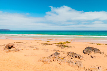 Sandstone rocks on empty beach of Porto Santo