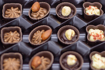 Few chocolates in brown box