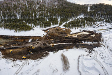 Altai mountains. Gold mining site. Gold dredge.