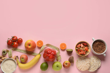Fototapeta na wymiar Composition with healthy products and measuring tape on pink background