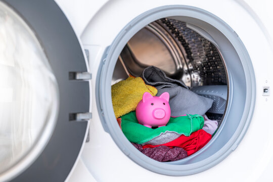 Concept Of Saving Electricity With A Washing Machine With A Piggy Bank Inside