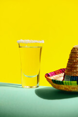 Shot of tasty tequila on color background, closeup