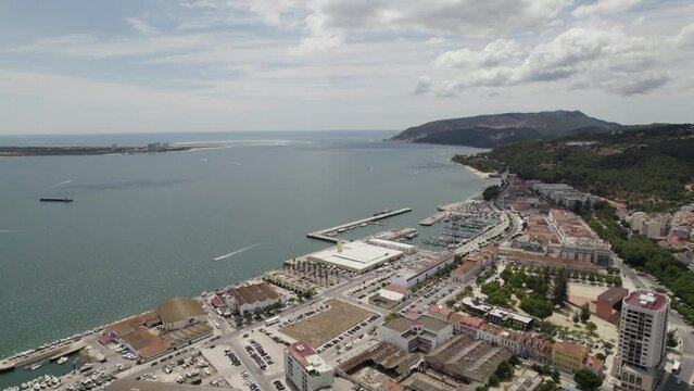 Drone pan reveals Fisherman's Wharf and Atlantic Ocean; Setubal, Portugal