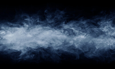 Abstract smoke texture over black. Fog in the darkness.
