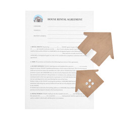 House rental agreement and wooden figures of houses on white background