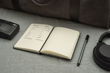 notebook with german / norwegian vocabulary and pen