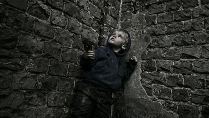 Child playing war in ruins