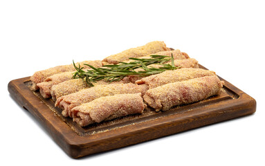 Beef schnitzel isolated on white background. Delicious raw meat schnitzel prepared with breadcrumbs and white sesame