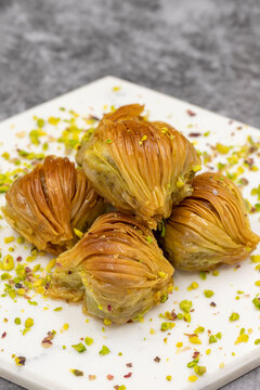 Mussel Baklava with Pistachio. Close-up. Traditional Middle Eastern Flavors. Traditional Turkish baklava. local name midye baklava