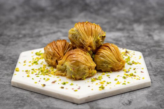 Mussel Baklava with Pistachio. Close-up. Traditional Middle Eastern Flavors. Traditional Turkish baklava. local name midye baklava