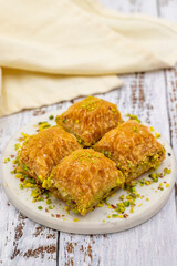 Pistachio baklava. Close-up. Traditional Middle Eastern Flavors. Traditional Turkish baklava. local name fistikli baklava