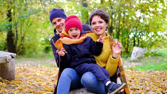Young family with little son are screaming while looking at camera. 