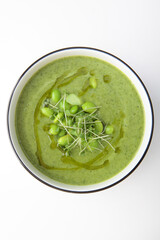 Cream soup with broccoli and spinach. Healthy food. Vegetarian soup. Healthy lifestyle. Lean menu. Isolated object. Photo on a white background. Top view with space to copy.Flat lay.