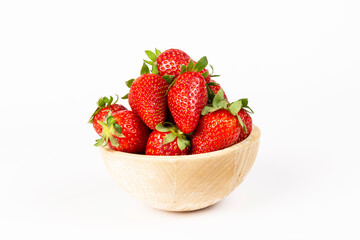 strawberries in bowl on marble on white background