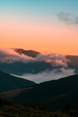 Petros Mountain in the morning fog, overcast mountain range at dawn, the magical mountains of Ukraine.