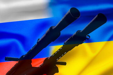 Military conflict between Russia and Ukraine, A gun against the background of two state flags of...