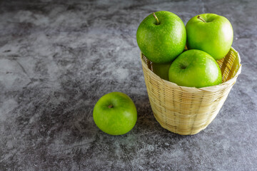 Green apples in a basket