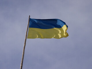 Yellow blue Ukrainian flag dark blue sky