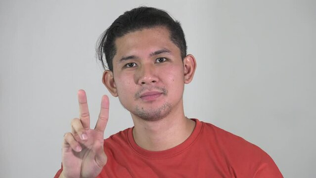A Pacifist Asian Male And Peace
