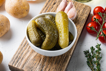Marinated cucumbers gherkins, on white background