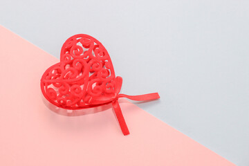 Red decorative love heart on paper background.