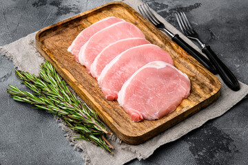 Pork steaks Raw meat, on gray stone table background