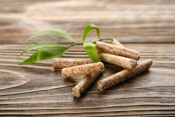 Wood pellets on wooden background