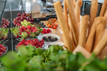 Various berries in bowls on display