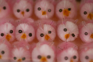 cute, fluffy, pink Easter chicks – extreme close-up, full frame, pastel toys