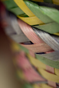 Easter egg baskets--close-up, selective focus, full frame, abstract background texture of colorful, pastel, stacked wooden Easter baskets
