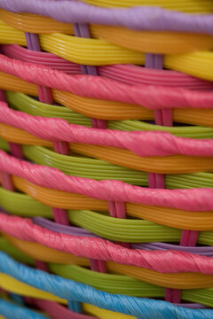 Easter egg baskets--close-up, selective focus, full frame, abstract background texture of colorful, pastel, stacked wooden Easter baskets