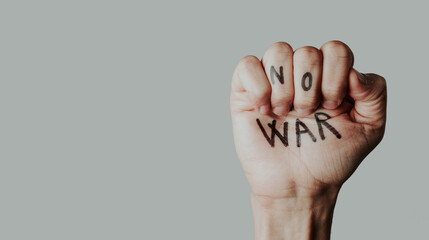 clenched fist with the text no war written in it